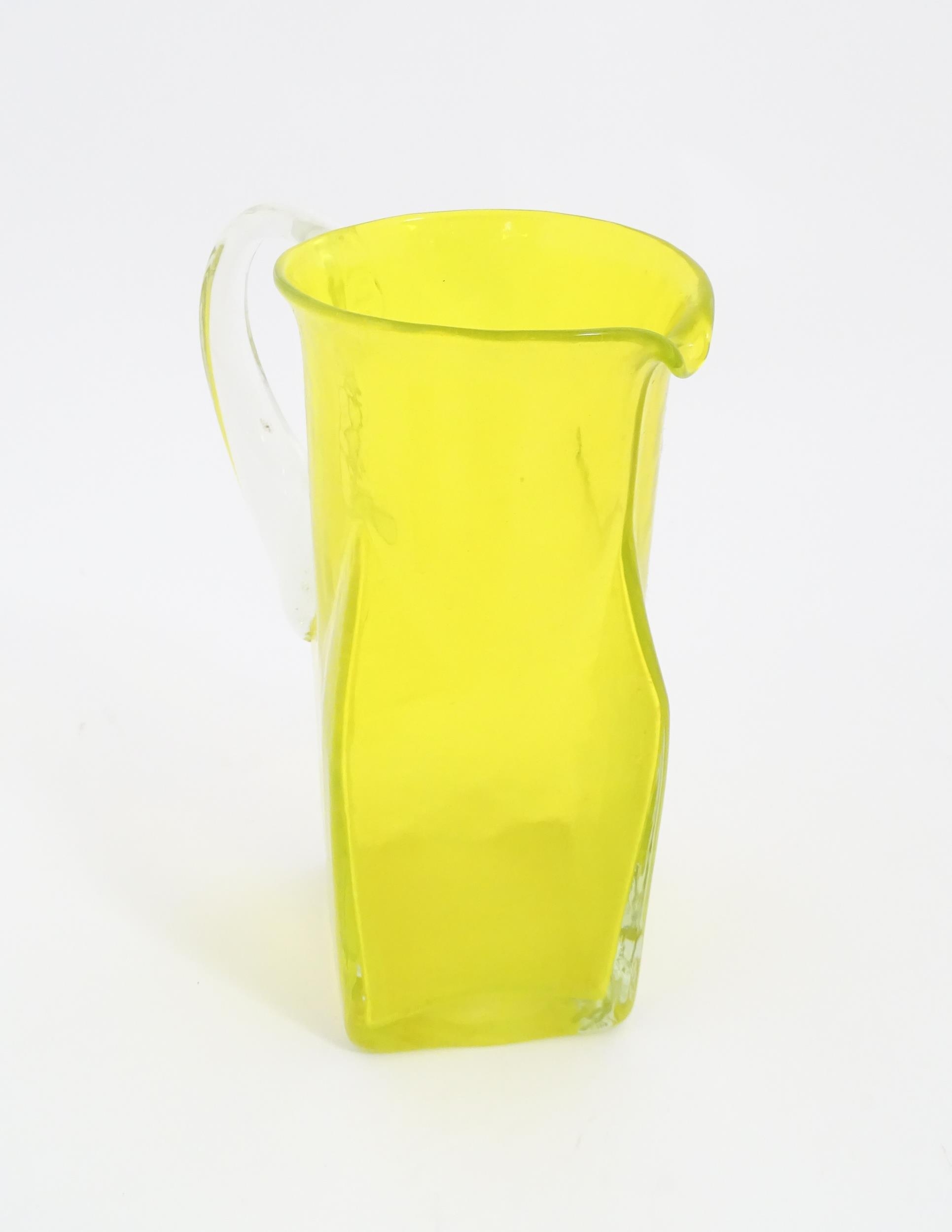 A 20thC yellow glass jug with squared base and clear glass handle. Approx. 8 1/2" high Please Note - - Image 5 of 11