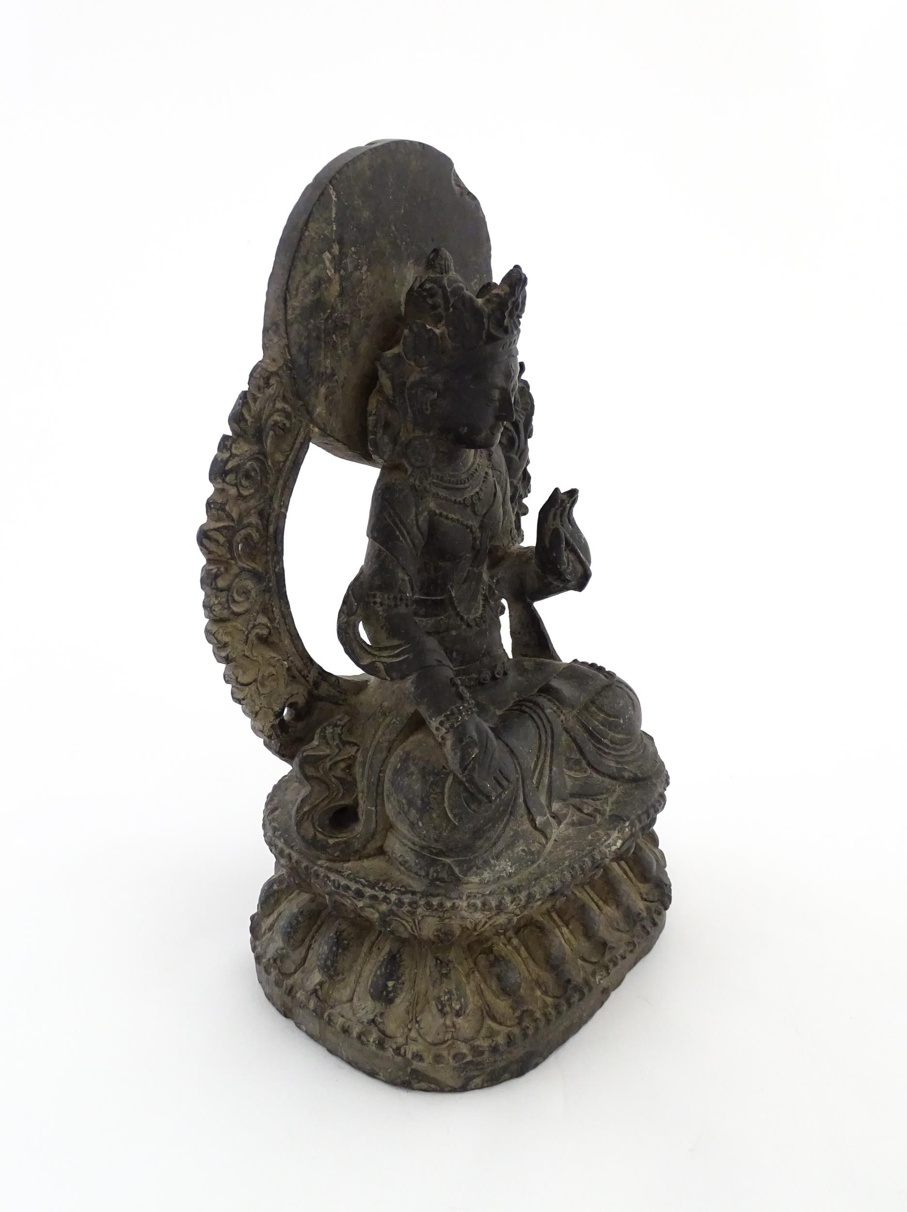 An Asian carved soapstone model of a seated deity on a stylised lotus. Approx. 14 1/2" high Please - Image 4 of 8