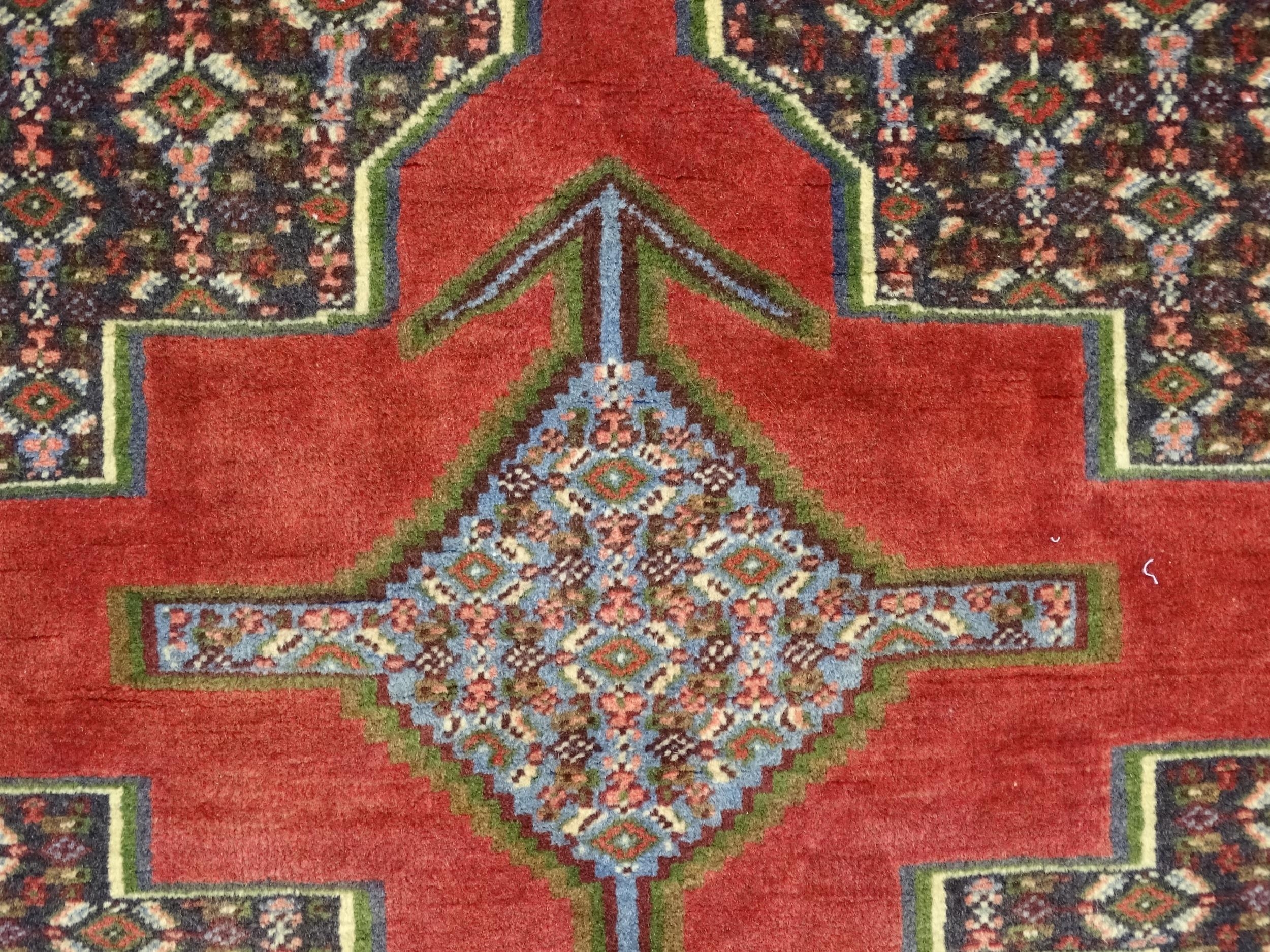 Carpet / Rug : A North West Persian Senneh runner with a red ground decorated with central repeating - Image 7 of 9