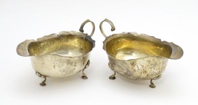 A pair of silver sauce boats hallmarked Birmingham 1909, maker E S Barnsley & Co. Approx. 5 3/4"