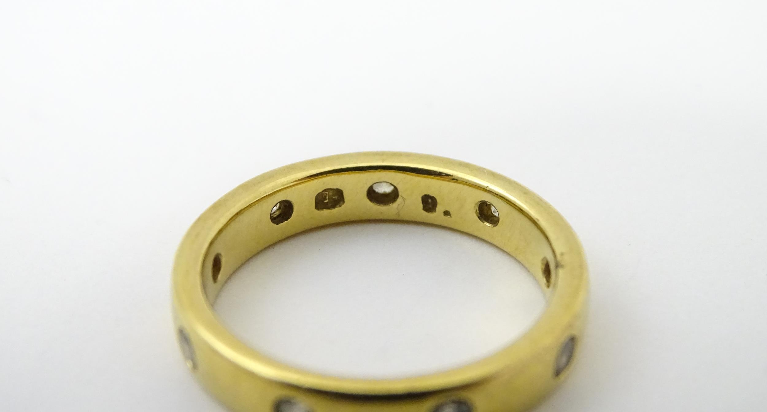 A yellow metal eternity ring set with white stones. Ring size approx. Q 1/2 Please Note - we do - Image 5 of 6