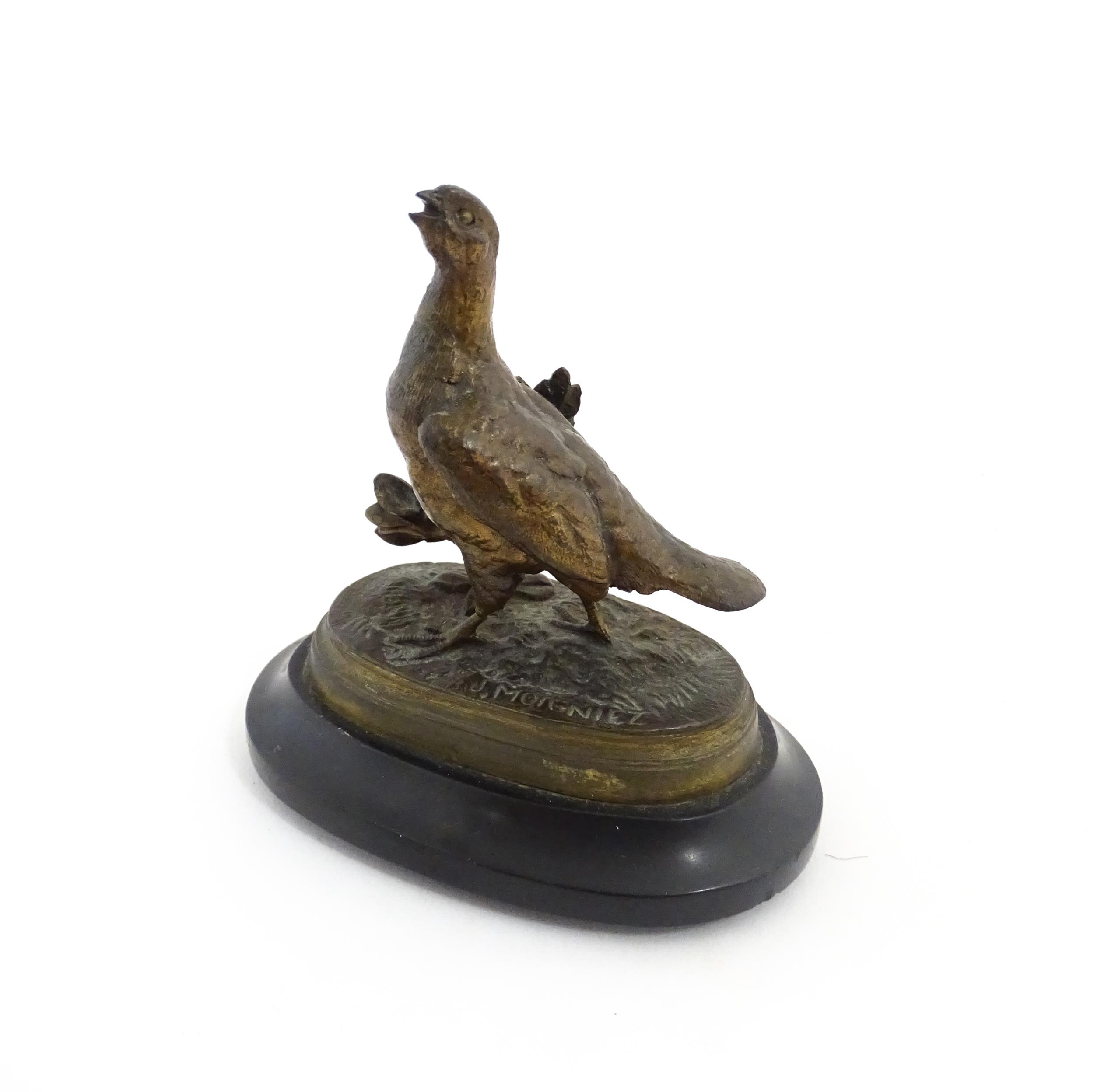 A 20thC cast bronze sculpture modelled as a partridge / bird after Jules Moigniez. Cast signature to