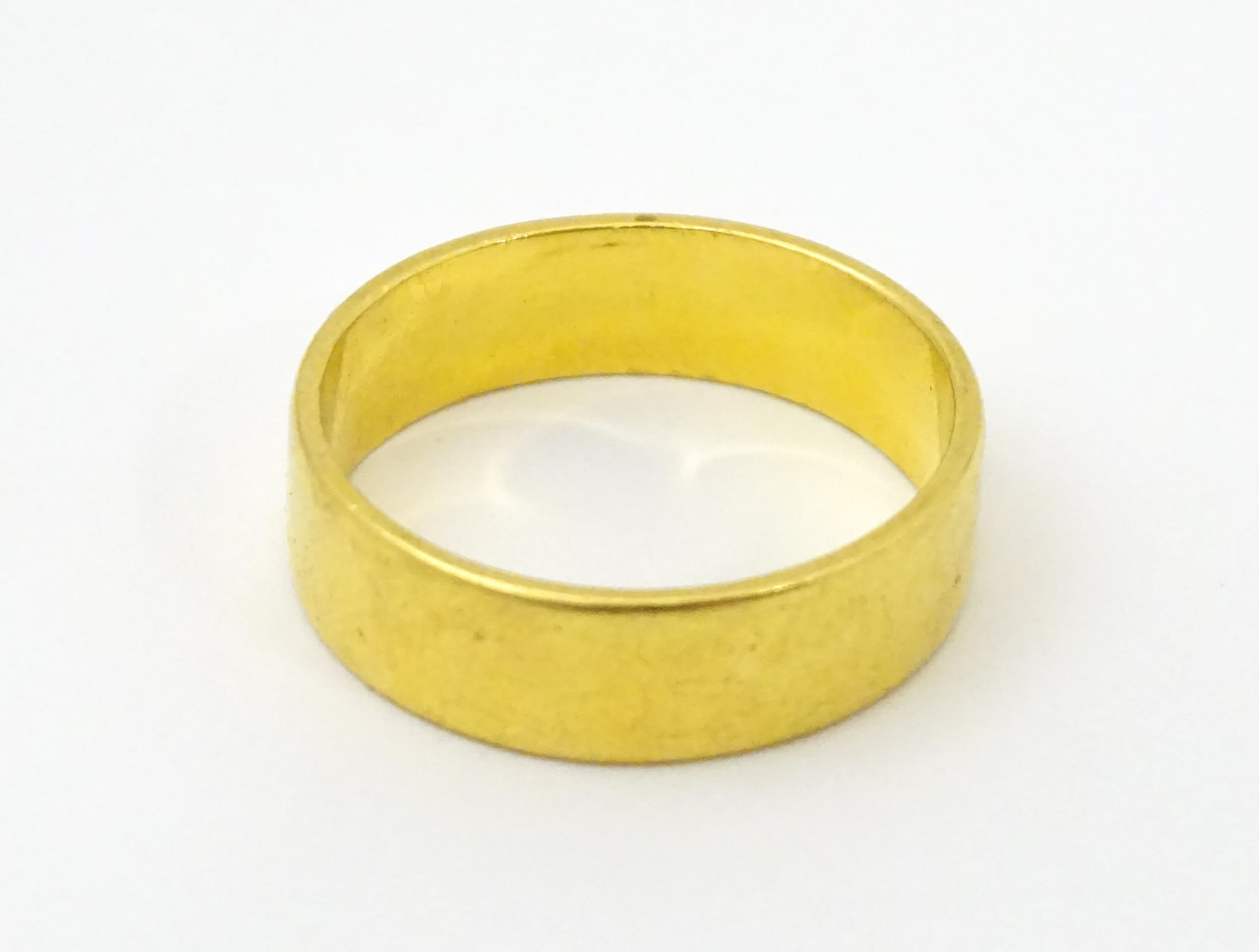 A 22ct gold ring / wedding band. Ring size approx. M 1/2 Please Note - we do not make reference to - Image 6 of 6