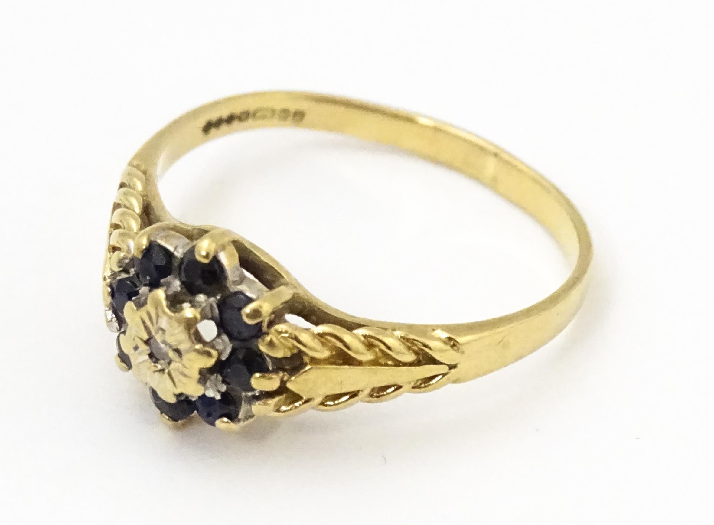 A 9ct gold ring set with central diamond bordered by sapphires. Ring size approx. M Please Note - we - Image 4 of 8