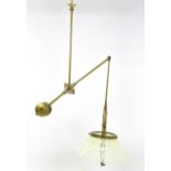 An Art Nouveau brass adjustable counter balance ceiling light with large flared vaseline glass