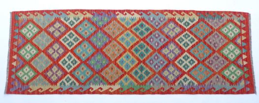 Carpet / Rug: A Turkish Anatolian kilim decorated with geometric motifs. Approx. 97" x 34" Please