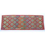 Carpet / Rug: A Turkish Anatolian kilim decorated with geometric motifs. Approx. 97" x 34" Please