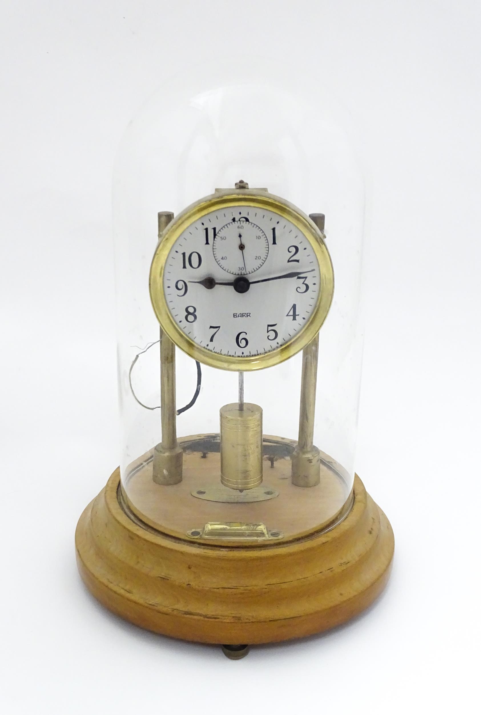 An American electric mantel clock by Barr , the dial with subsidiary seconds dial and signed Barr,