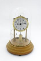 An American electric mantel clock by Barr , the dial with subsidiary seconds dial and signed Barr,