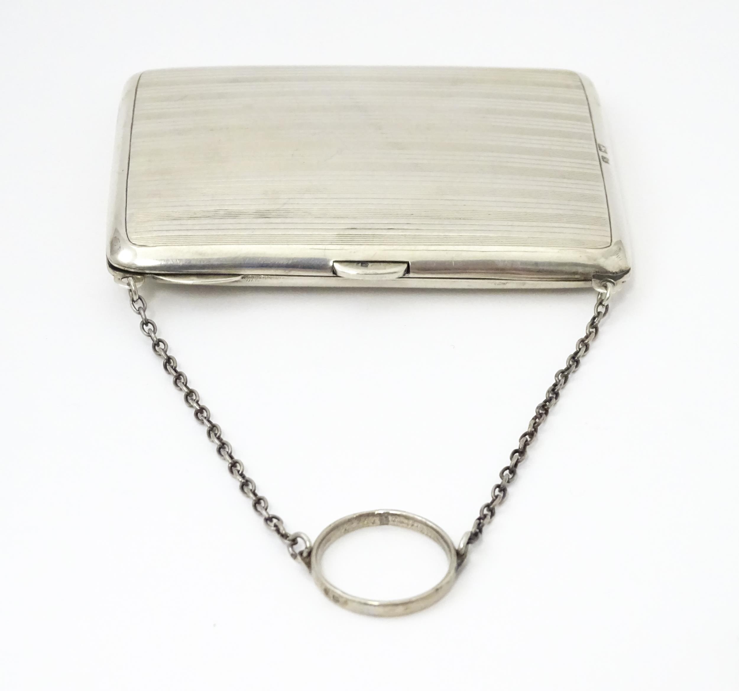 A silver purse / dance card case with leather lined interior. Hallmarked Birmingham, 1915 maker - Image 5 of 8