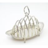 A silver seven bar toast rack hallmarked London 1905, maker J. Sherwood & Sons. Approx. 7 1/4"