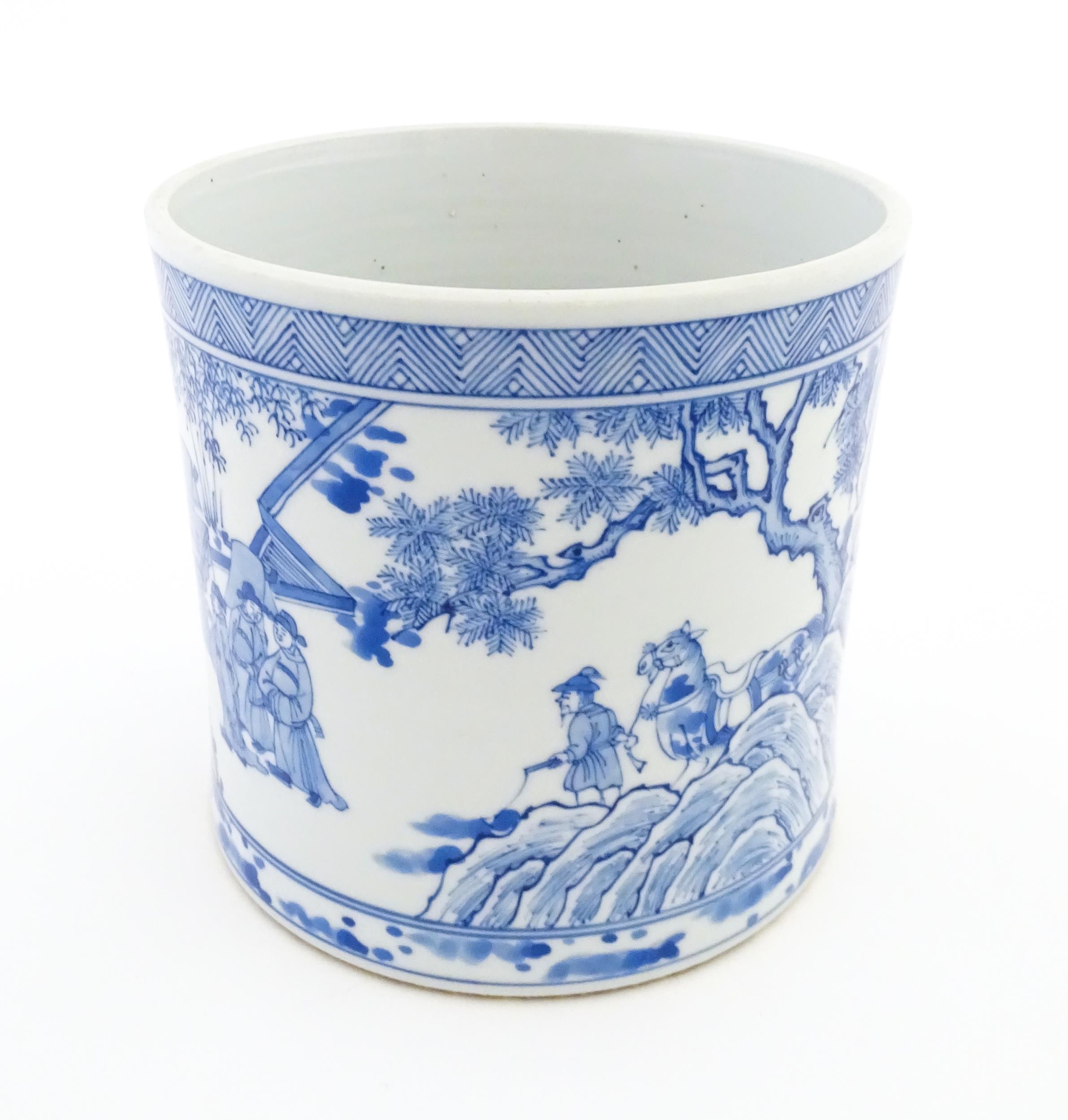 A Chinese blue and white vase / planter decorated with figures in a garden setting with a feast, and - Image 7 of 8