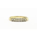A 9ct gold ring set with seven diamonds in a linear setting. Ring size approx. K 1/2 Please Note -
