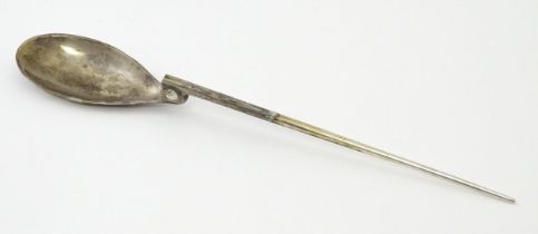 A silver replica of a Roman Christening spoon, indistinctly marked. Approx. 8 1/4" long Please