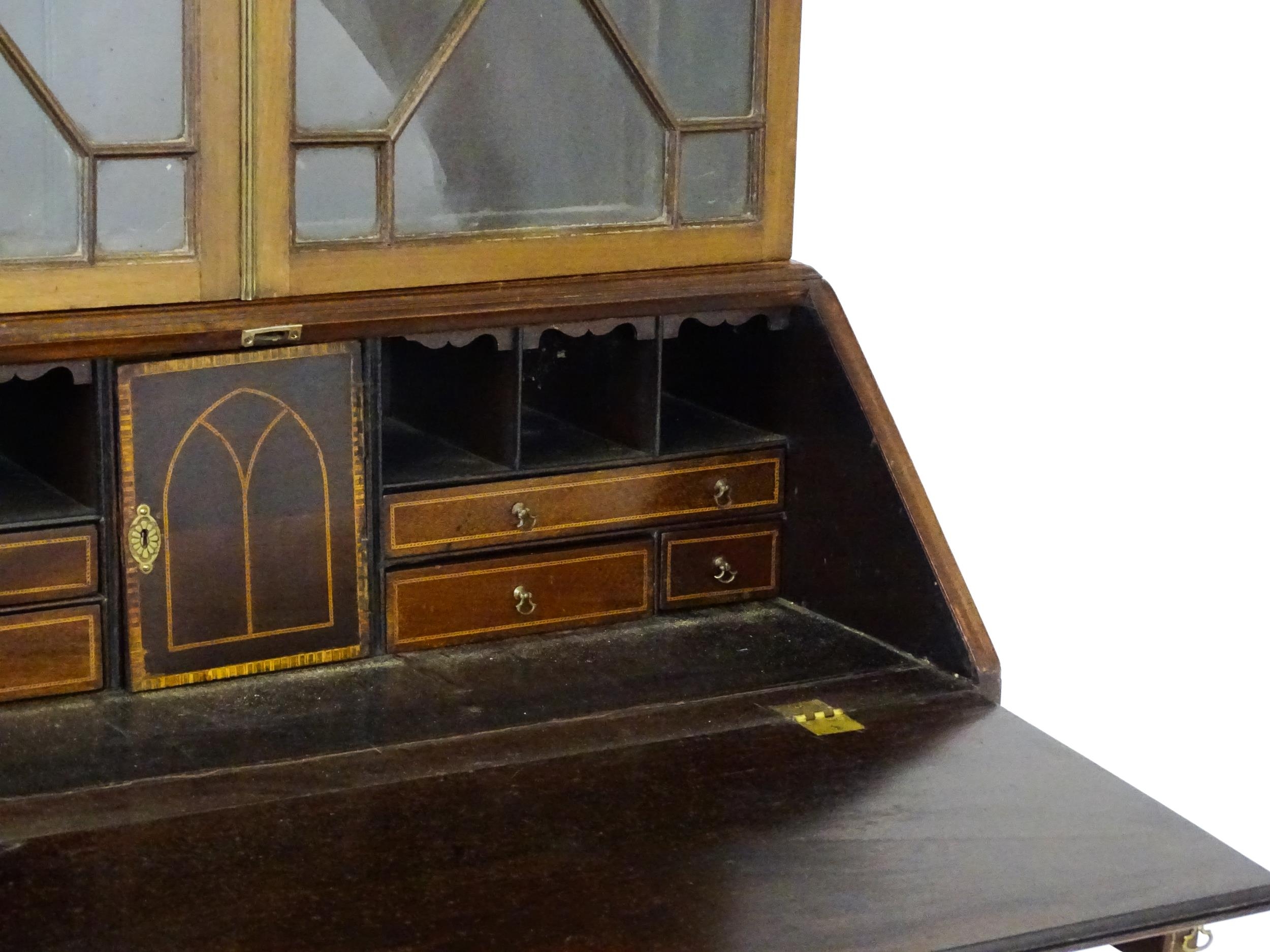 A Georgian mahogany bureau bookcase, with a moulded top above two astragal glazed doors and a fall - Image 9 of 11