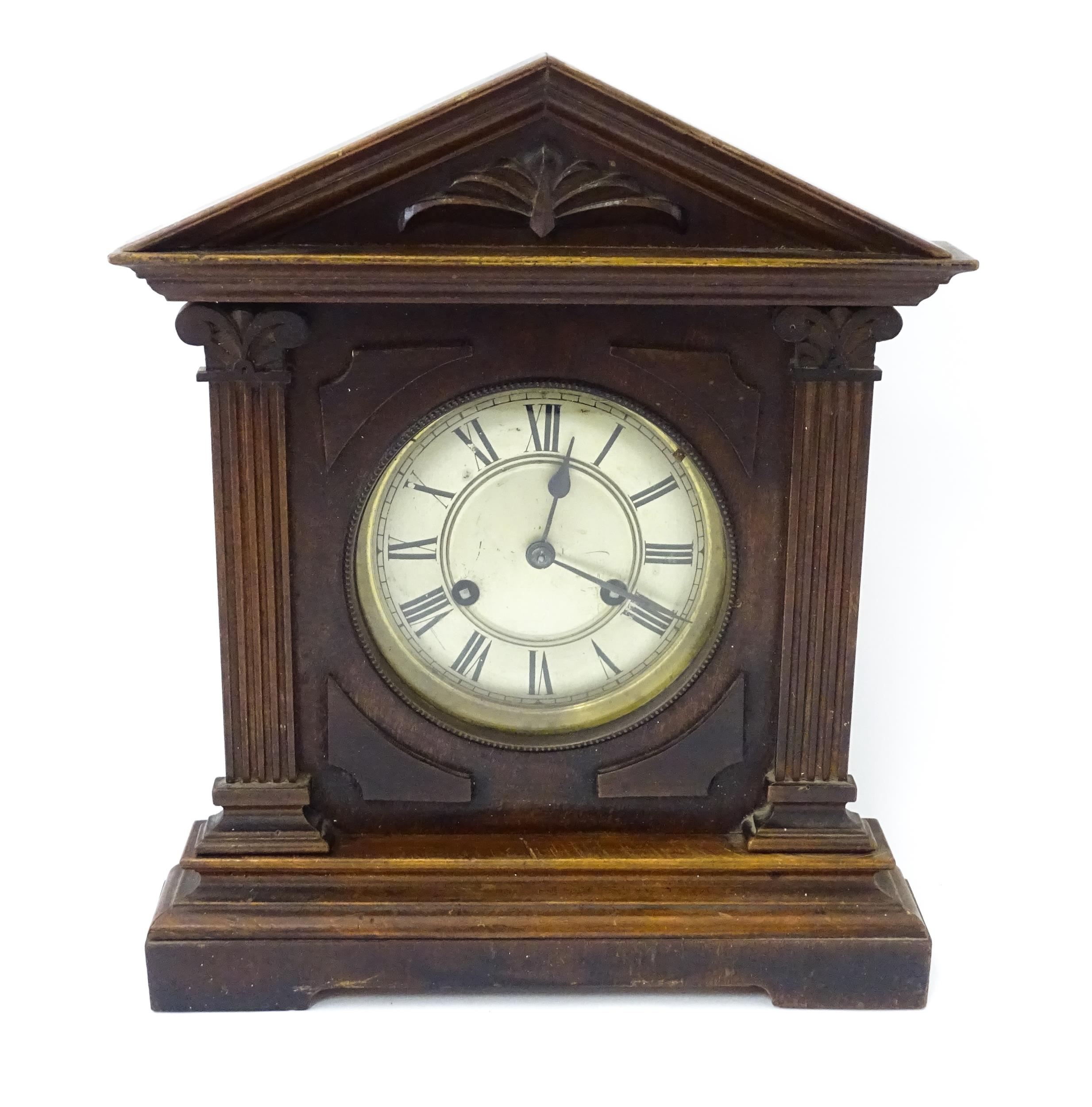 A late 19th/ early 20thC mahogany cased mantle clock by Philipp Haas & Sohne. The white enamel