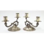 A pair of American silver twin branch candlesticks. Marked under Fisher Sterling. Approx 4 3/4" high