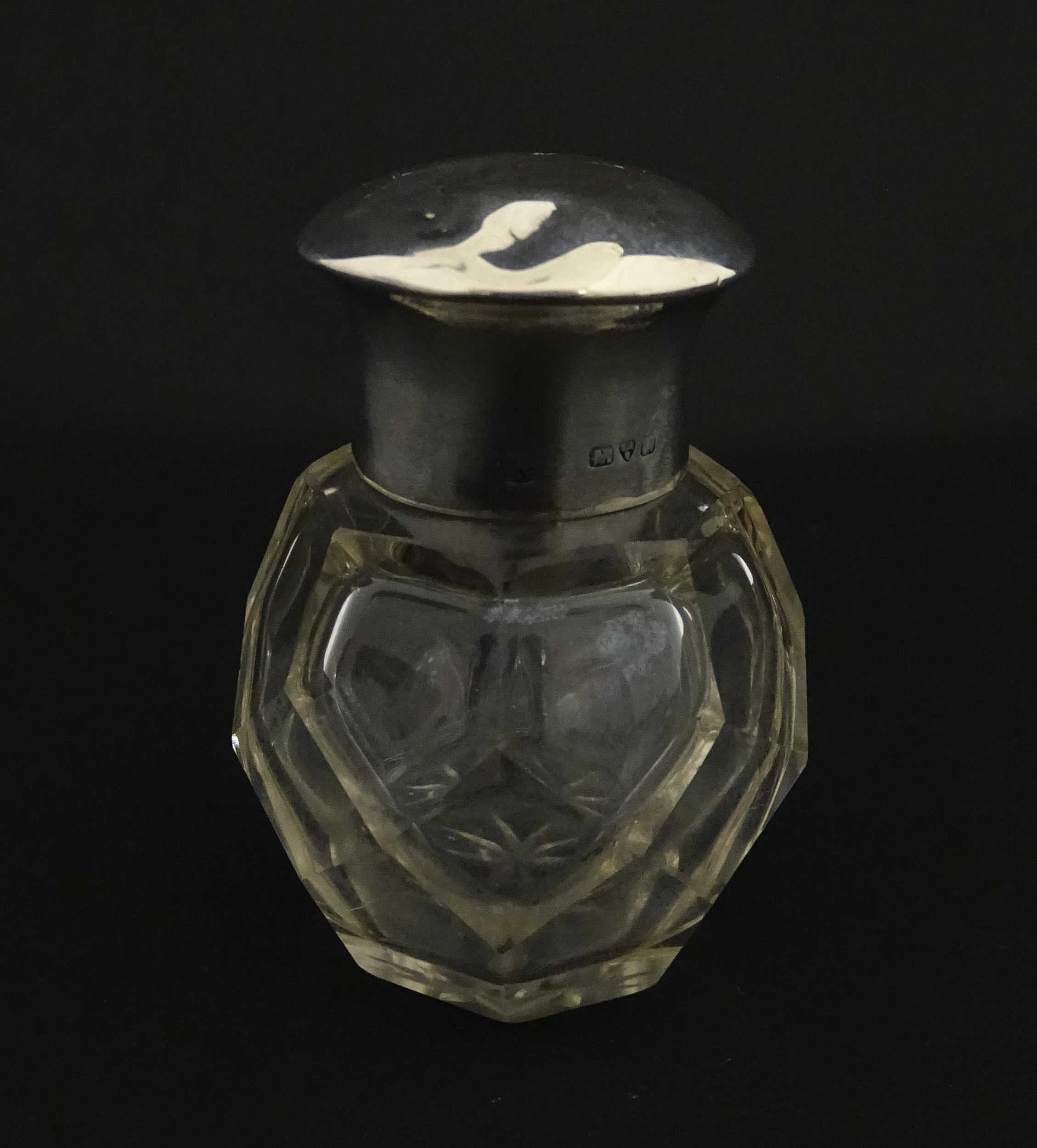 A cut glass scent / perfume bottle with silver top hallmarked Chester 1912. Approx. 2 3/4" high - Image 3 of 8