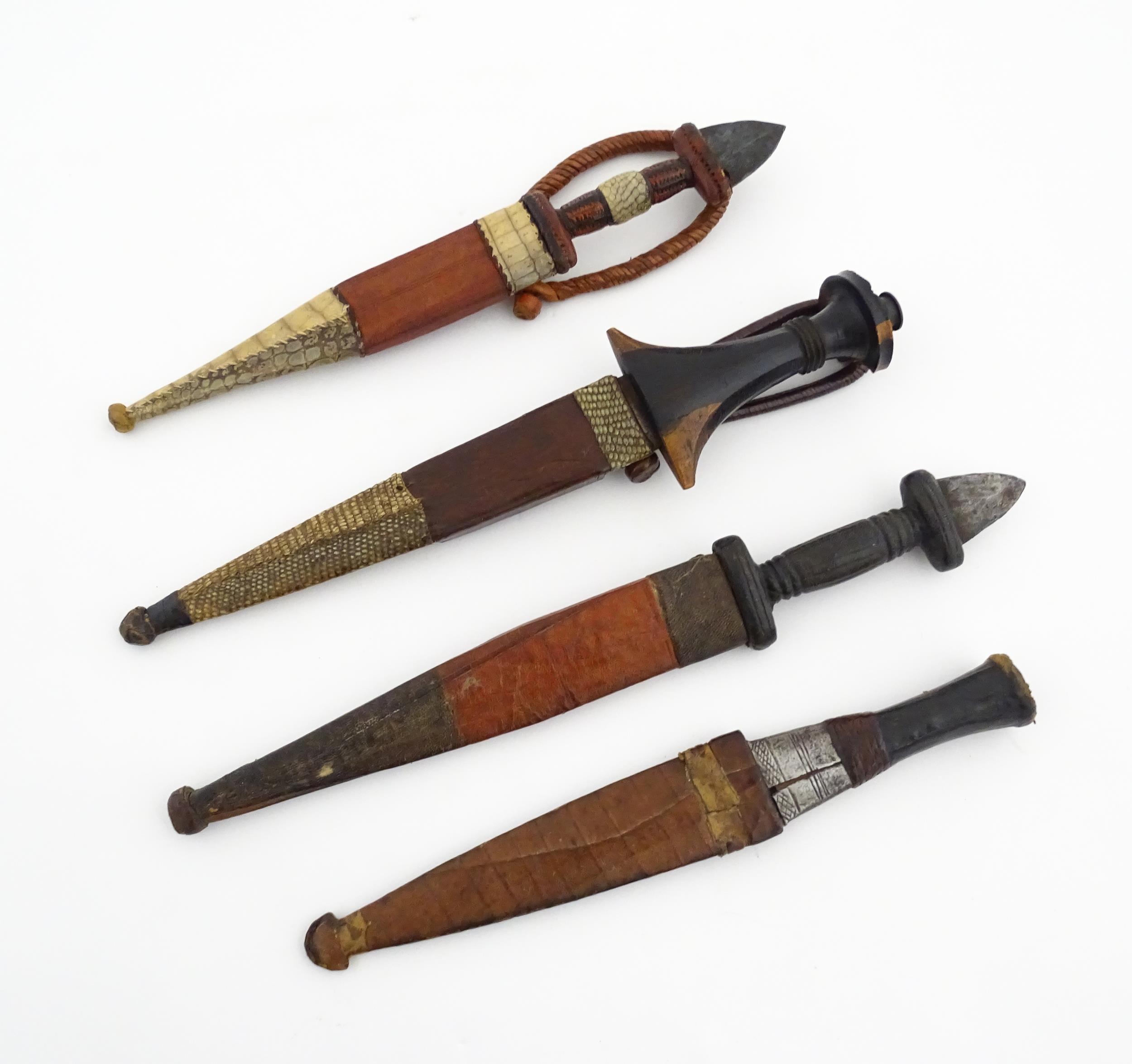 Ethnographic / Native / Tribal : Four assorted African / Sudanese arm knives / daggers, with leather