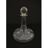 A cut glass flask of small ships decanter form with silver collar hallmarked Birmingham 1988,
