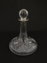 A cut glass flask of small ships decanter form with silver collar hallmarked Birmingham 1988,