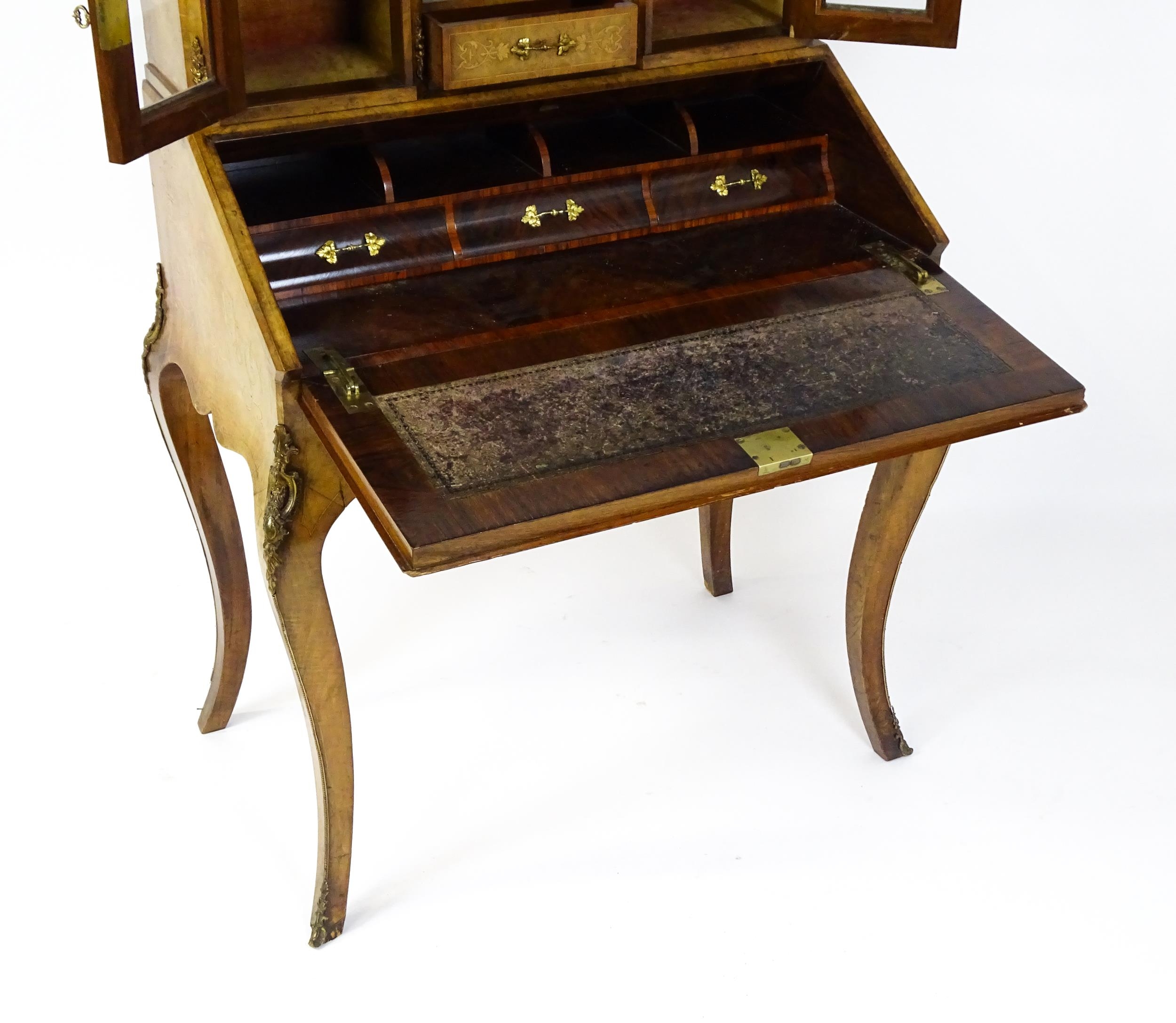 A 19thC burr walnut Bonheur du jour with a mirrored back stand and flanked by two glazed cabinets - Image 8 of 11