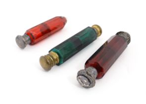 Three various Victorian double ended scent flasks compromising two ruby glass and a green glass