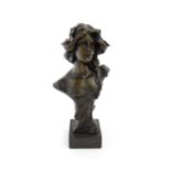 A 20thC cast bust depicting an young lady in the Art Nouveau style after Emmanuel Villanis.