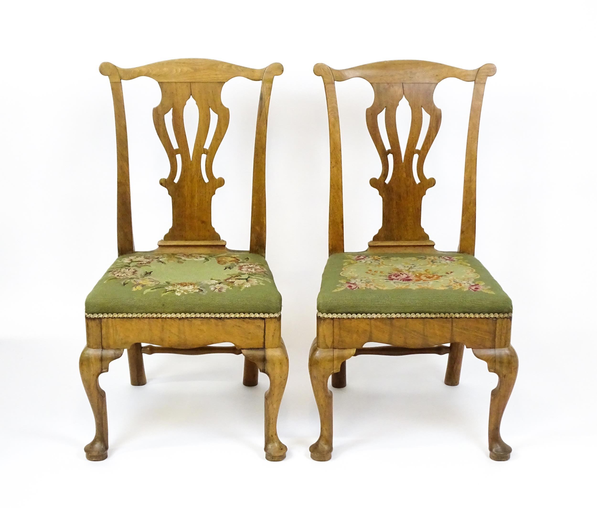 A pair of George II walnut side chairs with shaped top rails above pierced splats and raised on - Image 6 of 7