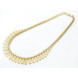 A 9ct gold necklace formed as a Cleopatra collar. Approx 16" long Please Note - we do not make