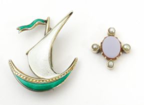 A Scandinavian .925 silver brooch of boat form with green and white enamel detail, maker Ivar T