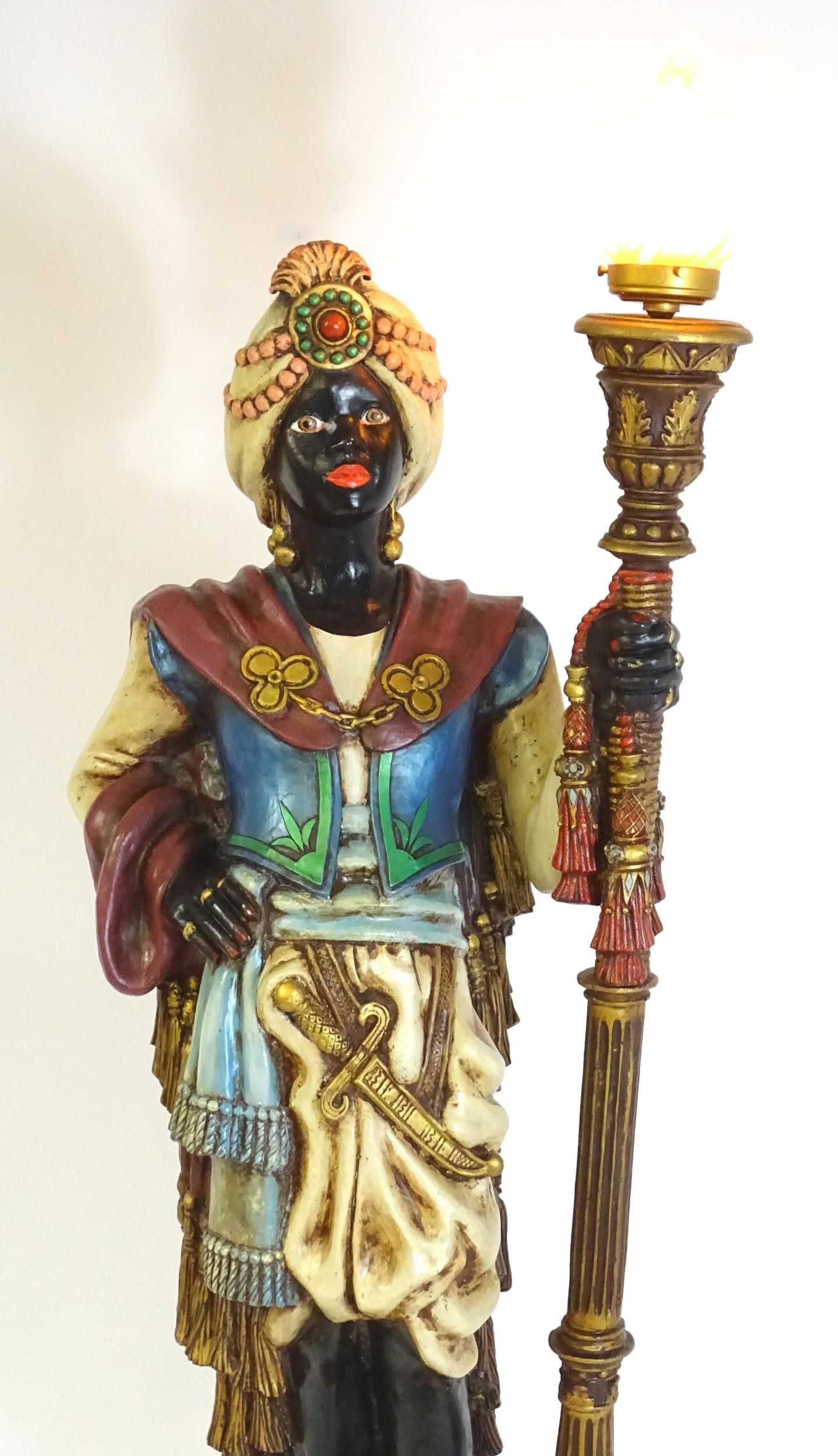 A mid 20thC blackamoor lamp, the lamp having a polychrome figural top grasping a torchiere, the - Image 7 of 14