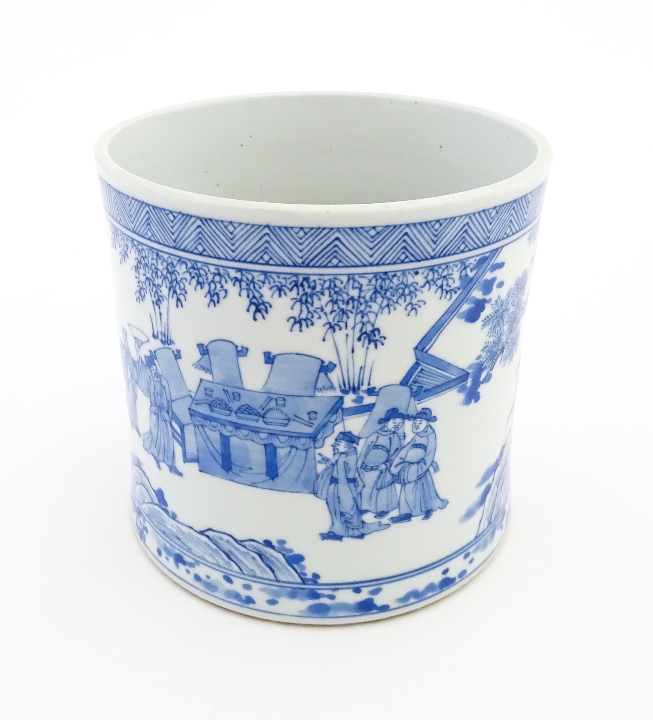 A Chinese blue and white vase / planter decorated with figures in a garden setting with a feast, and - Image 6 of 8