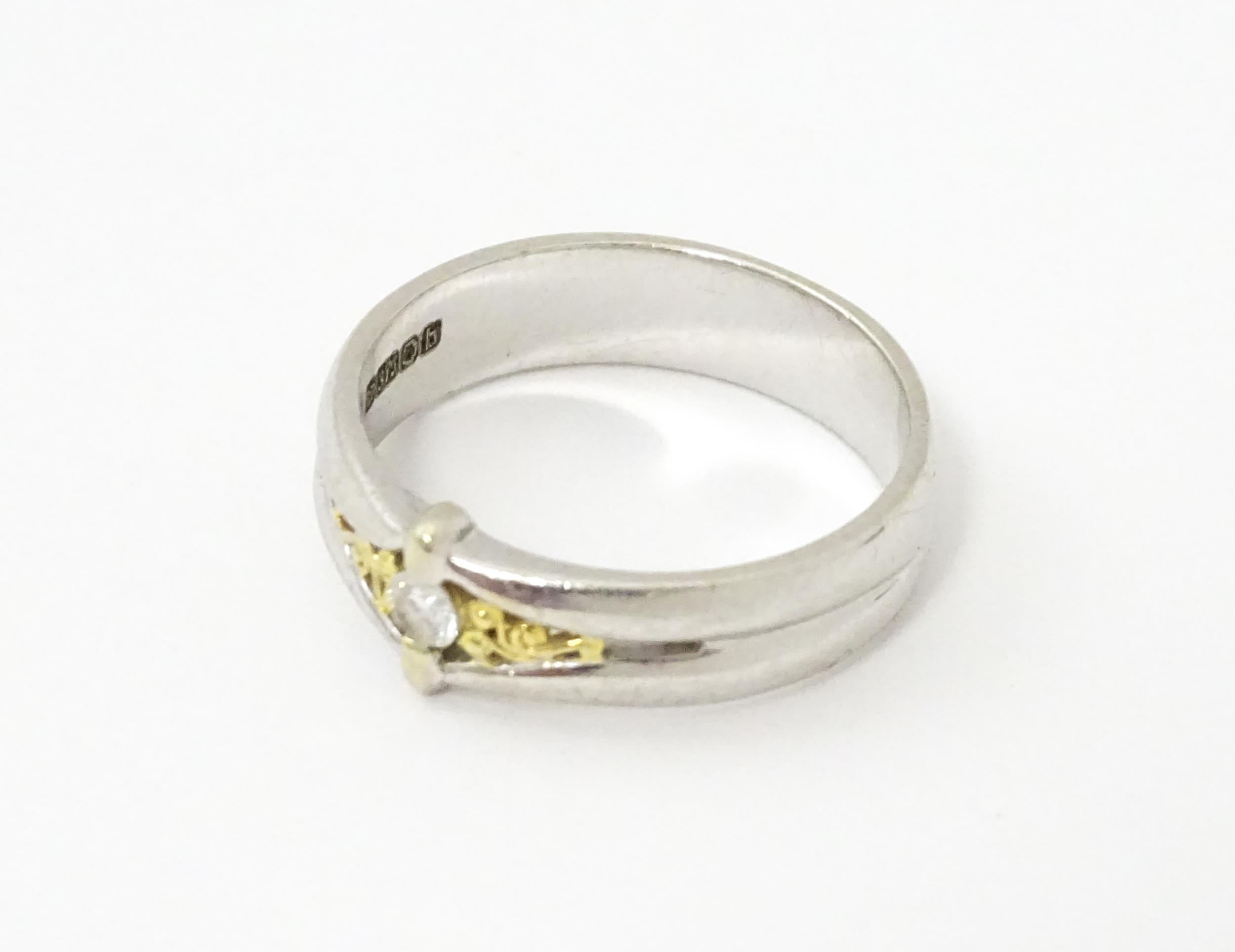 A 9ct white gold ring set with central diamond and gilt detail. Ring size approx. N Please Note - we - Image 4 of 6