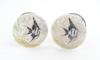 A pair of 20thC glass door knobs with fish detail. Approx. 2 1/2" diameter Please Note - we do not
