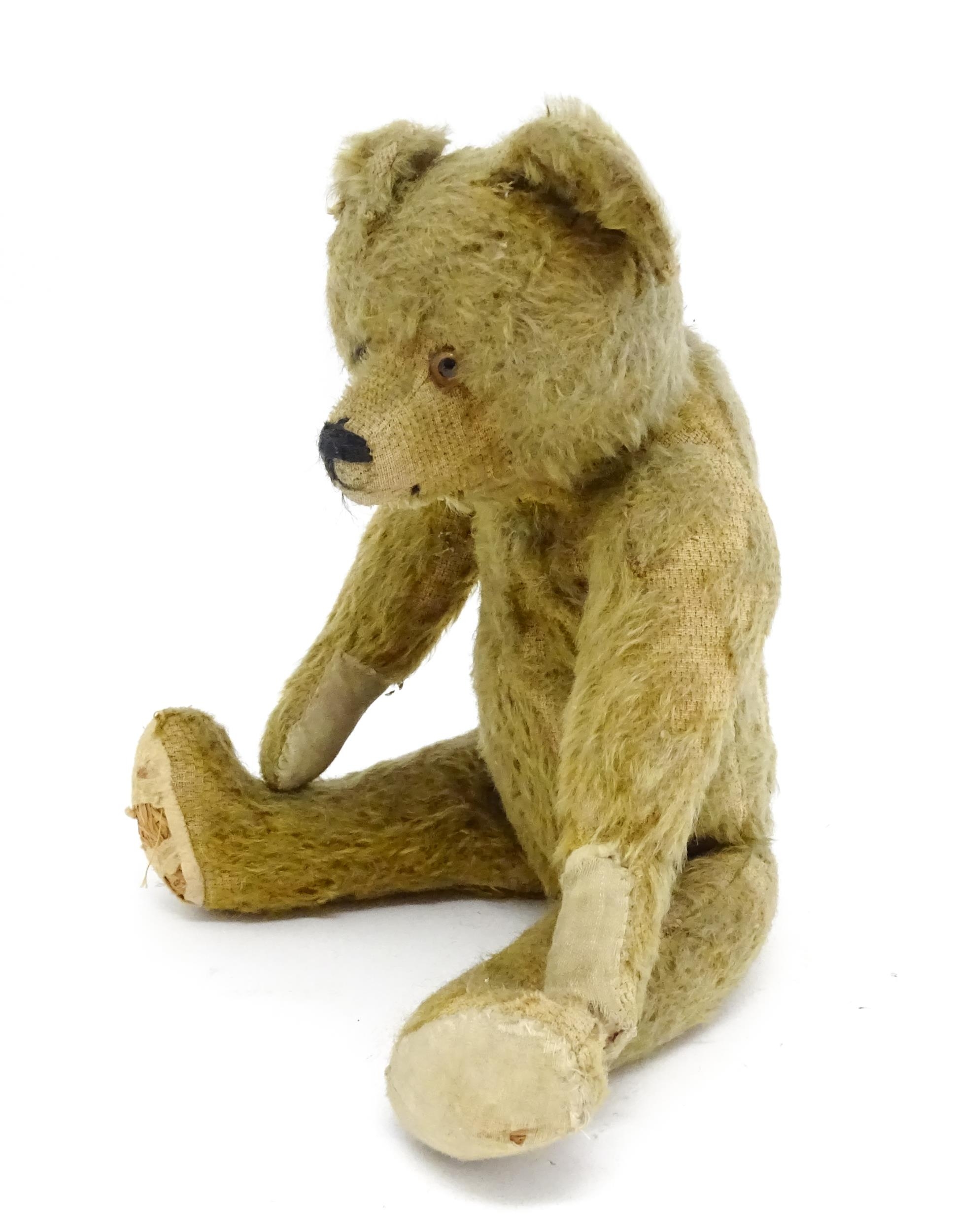 Toy: An early 20thC mohair straw filled teddy bear with proud nose, stitched mouth, hump back, - Image 7 of 9