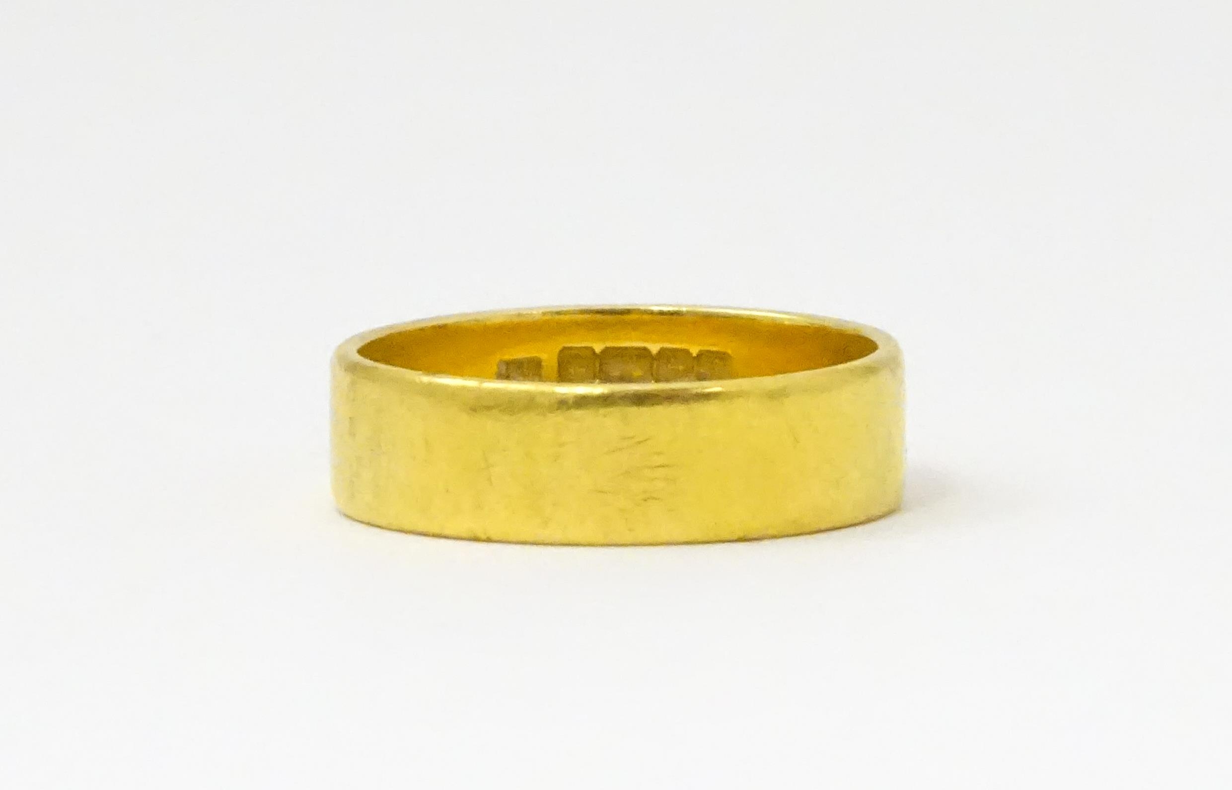 A 22ct gold ring / wedding band. Ring size approx. M 1/2 Please Note - we do not make reference to - Image 3 of 6