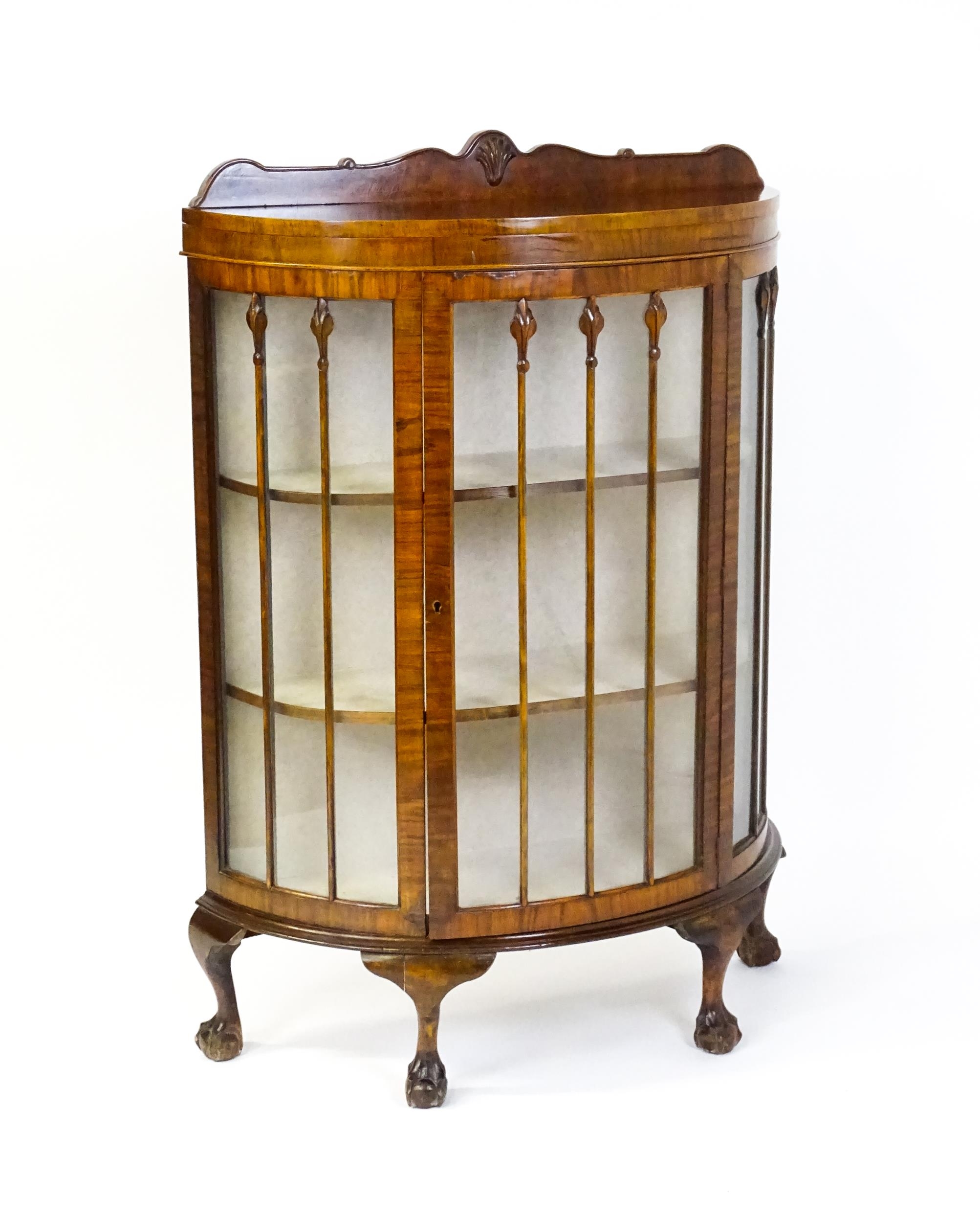 An early / mid 20thC walnut demi lune display cabinet with a shaped and carved upstand above a - Image 5 of 8