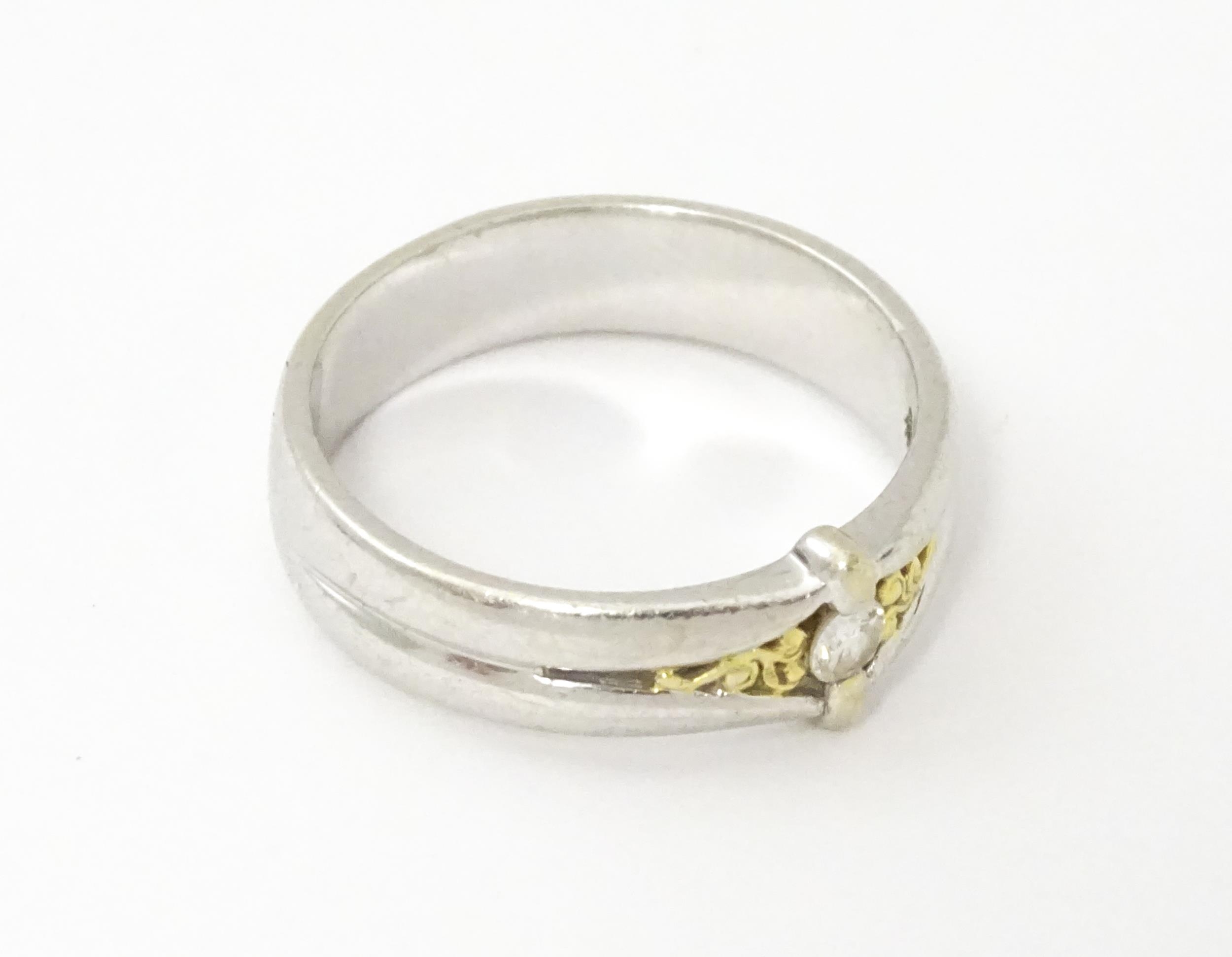 A 9ct white gold ring set with central diamond and gilt detail. Ring size approx. N Please Note - we - Image 5 of 6