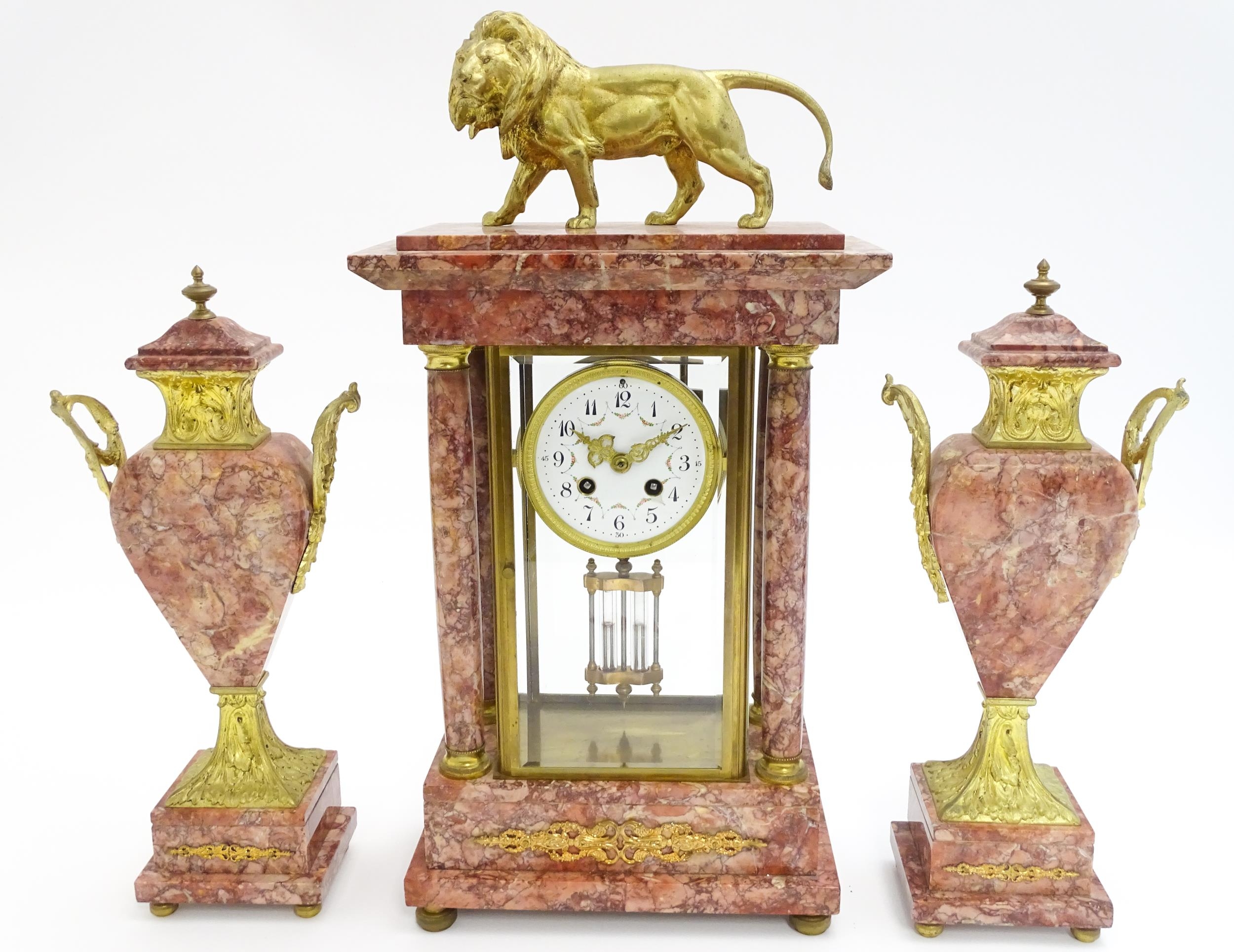 A 19thC French Three-Piece Clock Garniture, by Marti, having a white dial with floral garland swags,