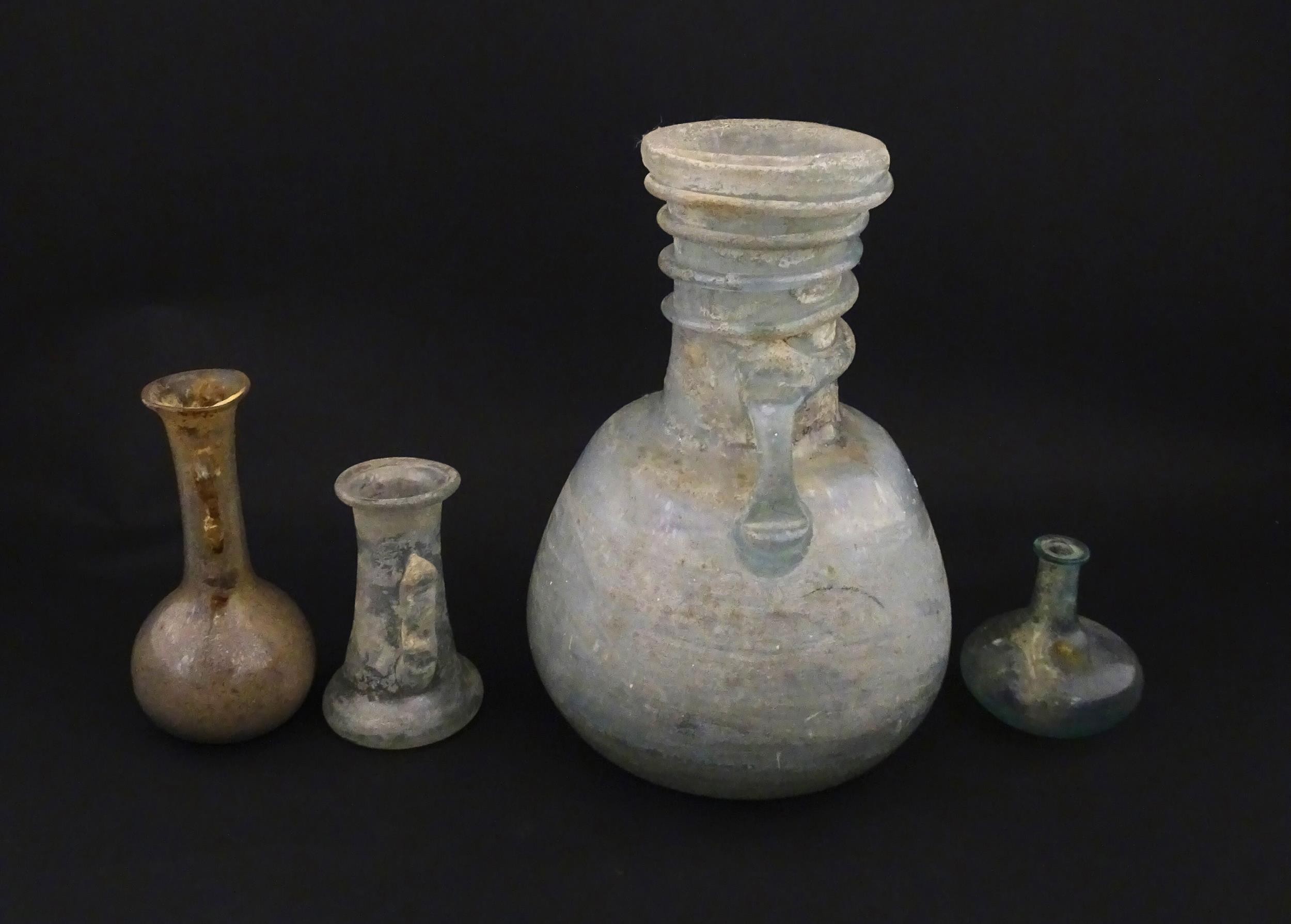 Four glass vases in the Roman style with iridescent finish, some with trail detail. Largest - Image 5 of 6