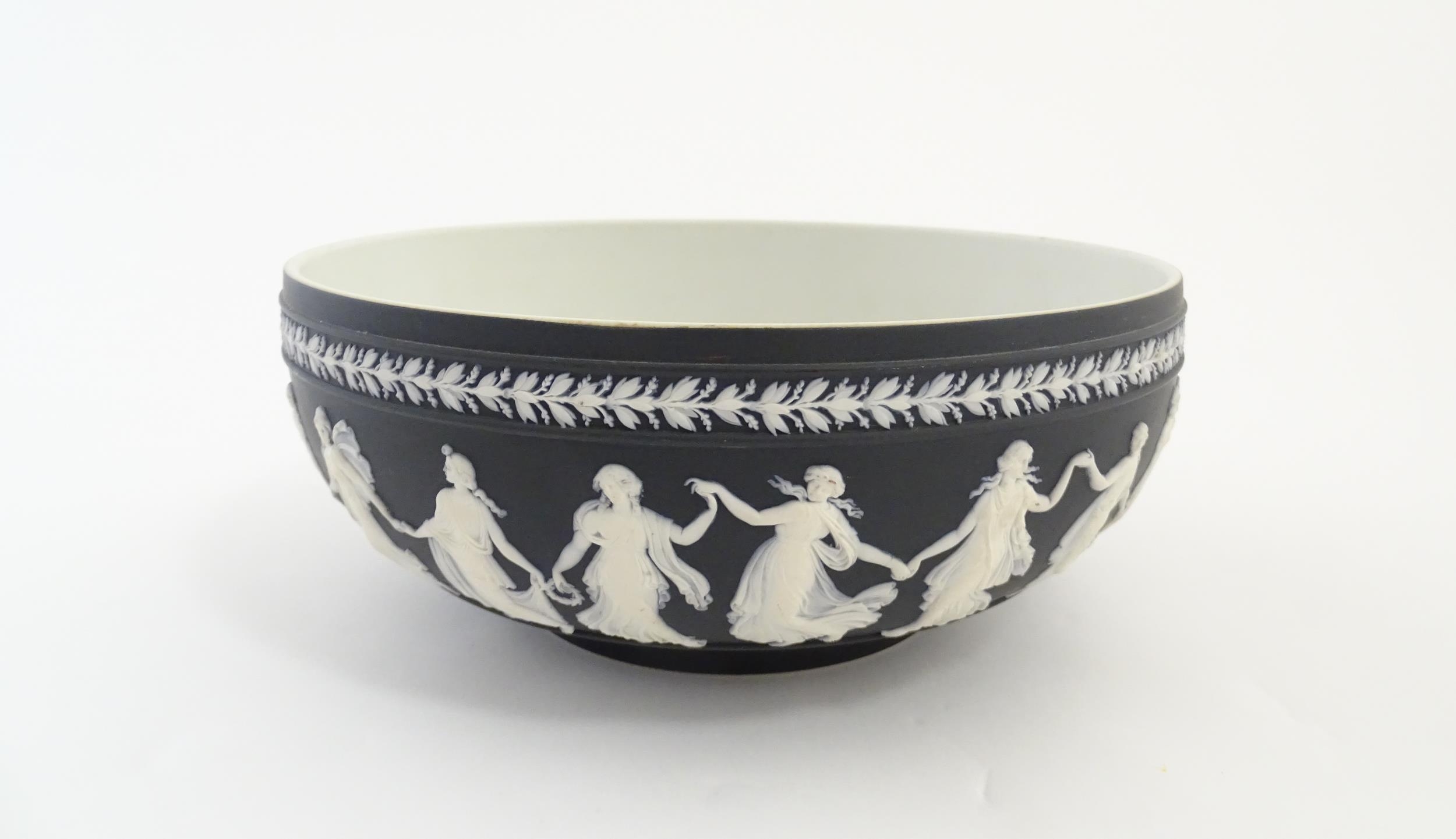 A Wedgwood black Jasperware bowl decorated with Classical maidens / Dancing Hours. Marked under. - Image 3 of 9