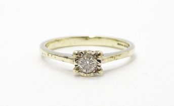 A 9ct white gold ring set with diamond solitaire. Ring size approx. J 1/2 Please Note - we do not