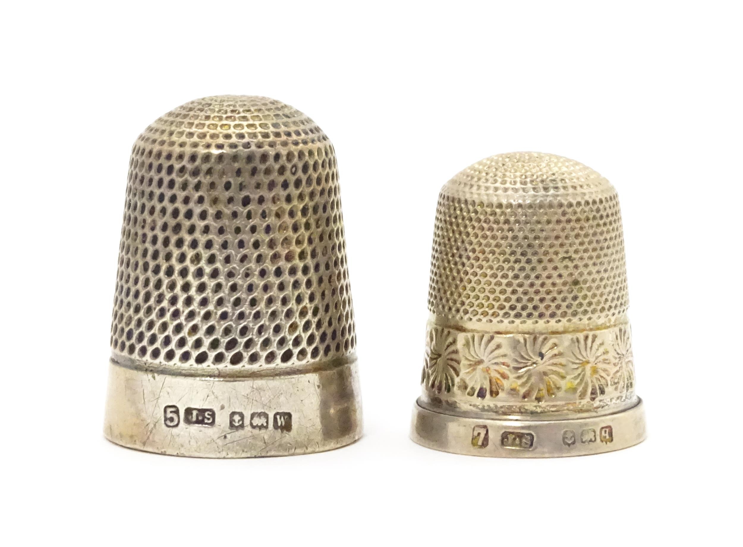 Two silver thimbles hallmarked Birmingham 1915 / 1921, maker James Swann (2) Please Note - we do not