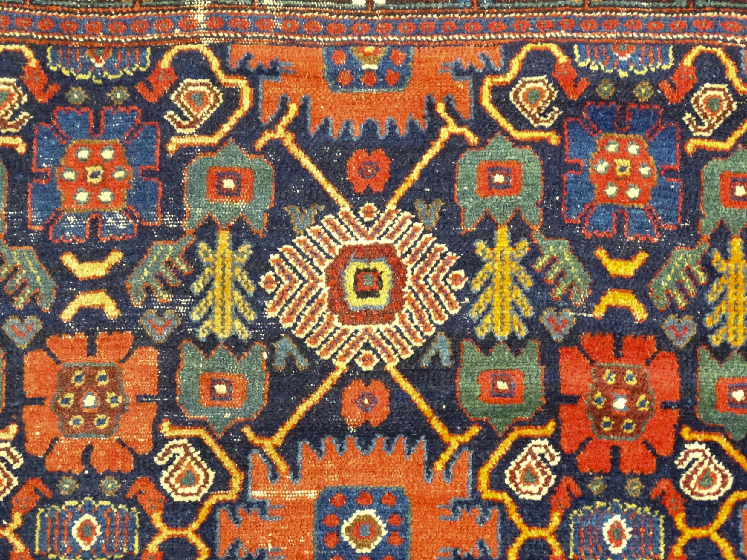 Carpet / Rug: A blue ground rug decorated with repeating geometric motifs of stylised floral and - Image 5 of 8