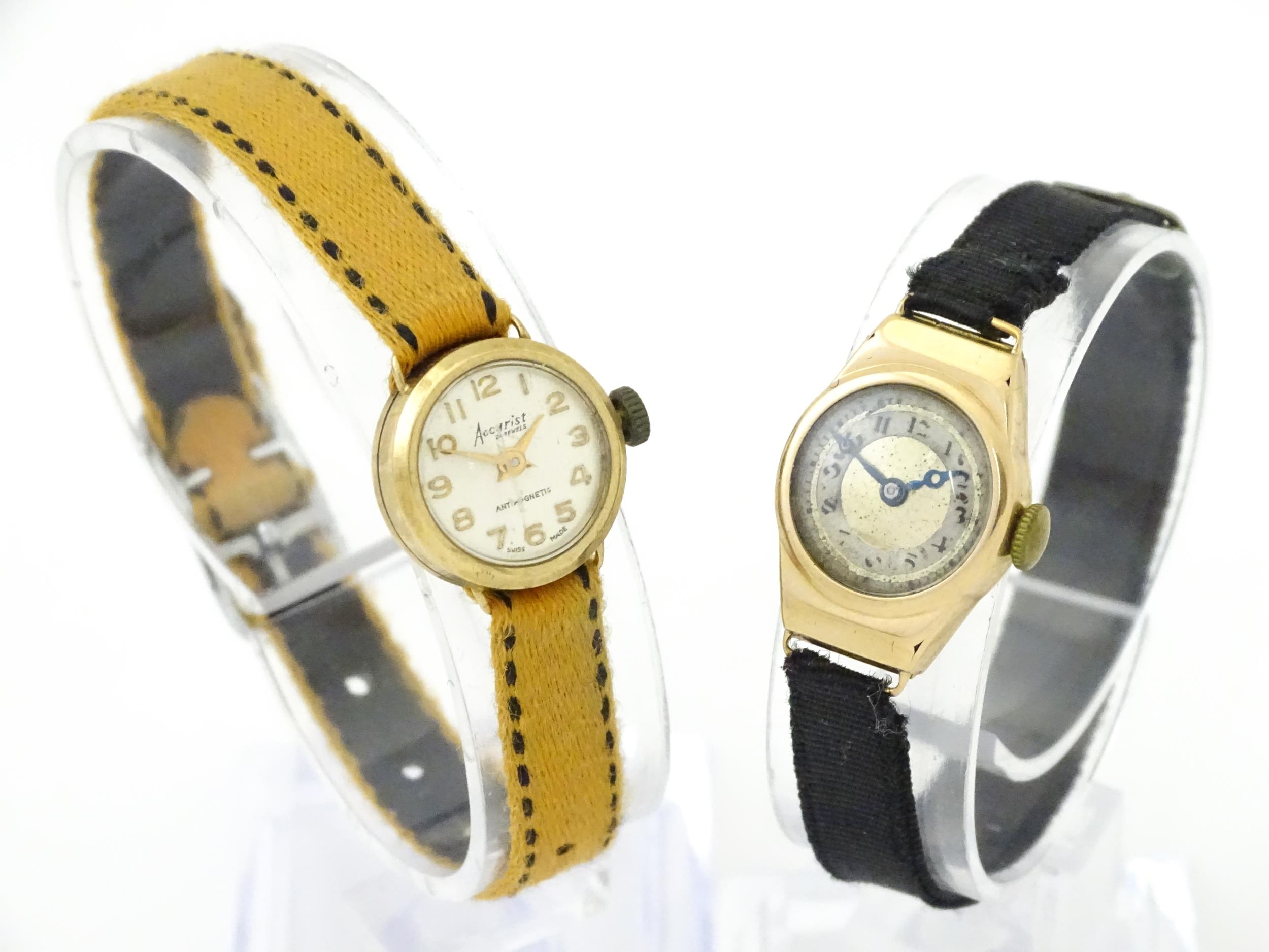 Two 9ct gold cased ladies wristwatches to include one watch by Accurist. Approx 1/2" wide (2) Please