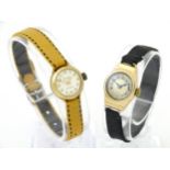 Two 9ct gold cased ladies wristwatches to include one watch by Accurist. Approx 1/2" wide (2) Please