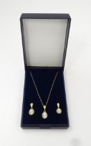 A pair of earrings set with cameo detail. Together with a matching pendant on a 9ct gold chain.