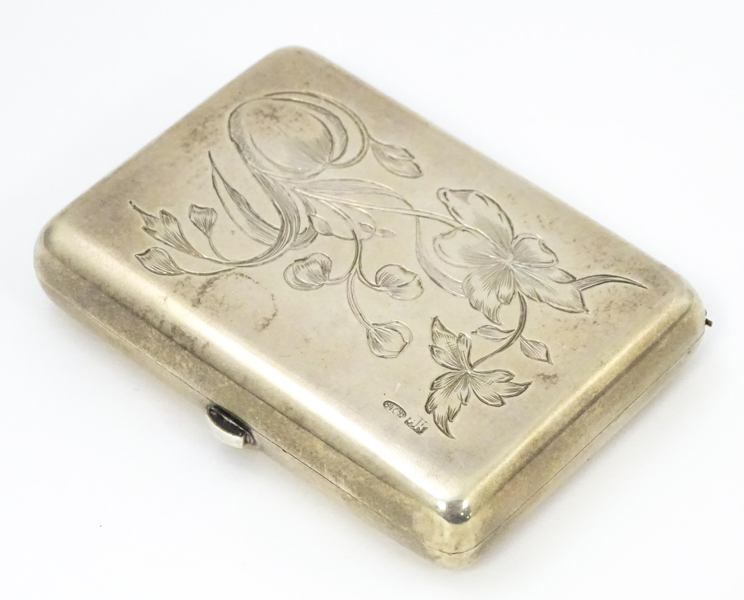 A late 19th / early 20thC Russian silver cigarette / snuff box with engraved floral decoration.