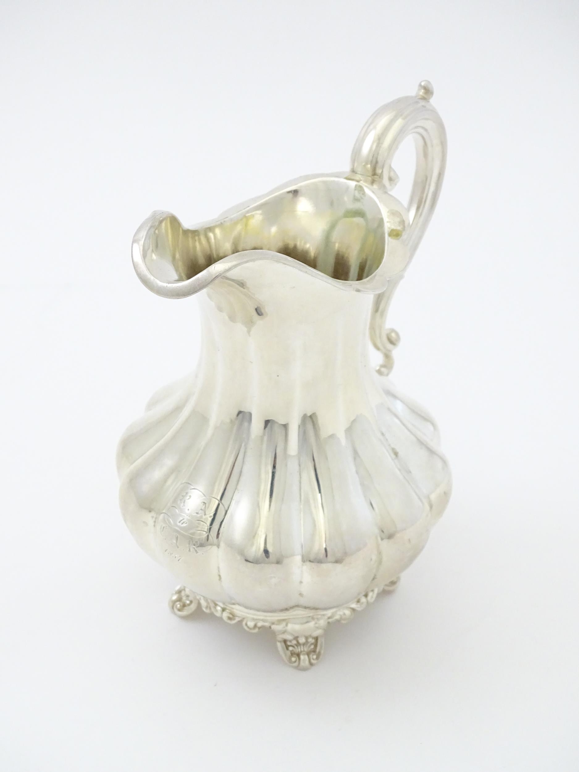 A Victorian silver jug hallmarked London 1851, maker Samuel Hayne & Dudley Cater. Approx. 6 1/4" - Image 3 of 6